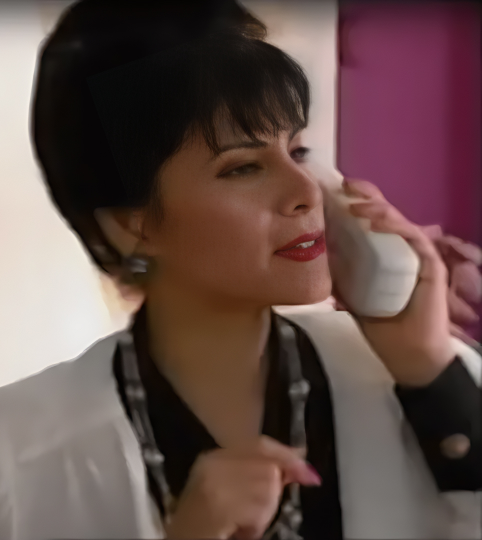 Soap opera villain talking on the phone