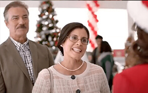A married couple talk to a Toyota car saleswoman